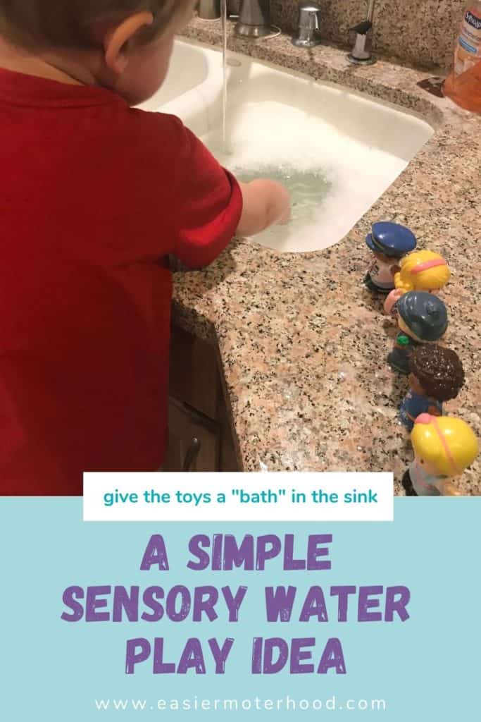 a child engaging in sensory play in the sink, hands are in the water with toys to the side of the sink, and a text description underneath