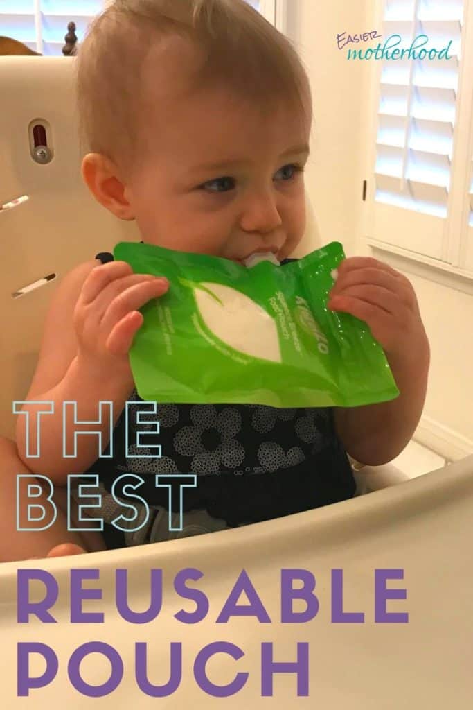 Toddler eating yogurt out of a reusable baby food pouch in a highchair, with overlayed text reading "the best reusable pouch"