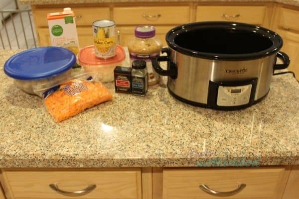 Crockpot and the initial ingredients that go into the slow cooker in the morning to make slow cooker chicken potato chowder
