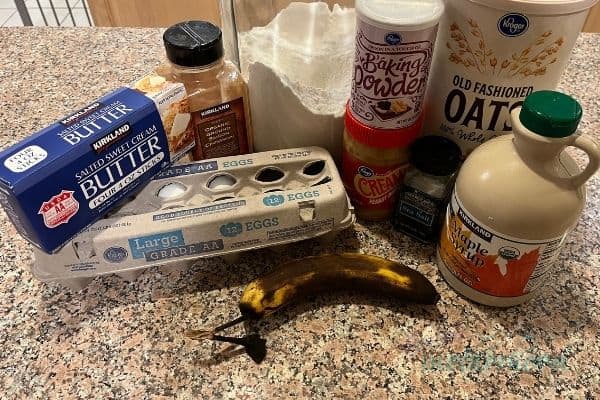 Ingredients on kitchen counter for peanut butter and banana oat bars