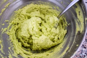 The avocado deviled egg filling in the mixing bowl after combining